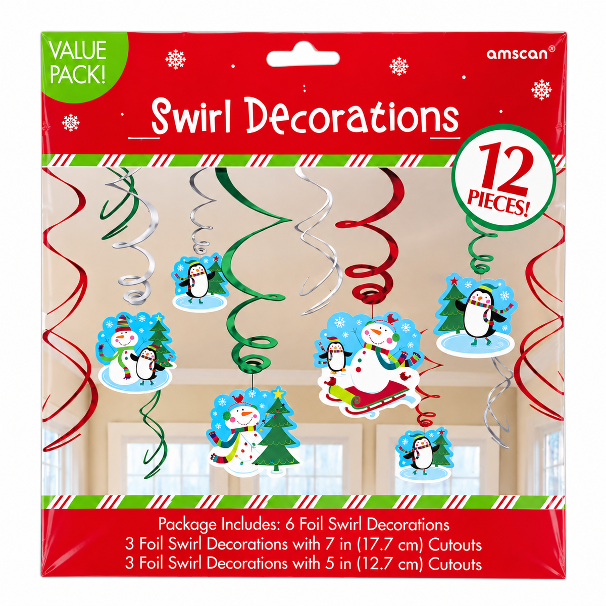 A retail package of amscan Swirl Decorations, a 12-piece holiday value pack. The packaging features festive red and green borders, white text, and illustrations of penguins, snowmen, and Christmas trees on the hanging spiral decorations shown against a window background.